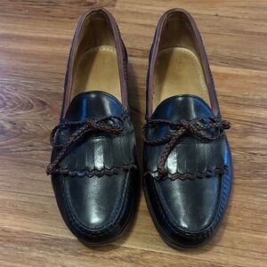 Allen Edmonds Black and Brown Leather Black Kiltie Braid Bow Loafers.